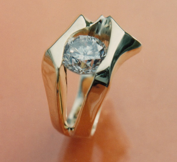 Large diamond channel set in exotic freeform design.