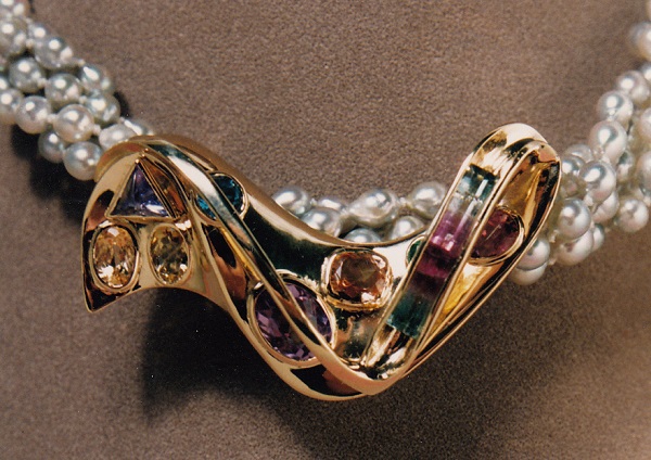 Gold Pearl enhancer with adorned in tourmaline crystals 